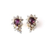 Yellow gold ruby and diamond cluster earrings.