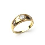 18 ct yellow gold three stone diamond gypsy ring.