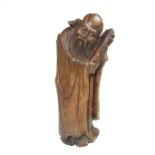 A Chinese carved wood figure, 20th century.