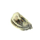 A Japanese carved ivory netsuke of an octopus, Meiji period (1868 - 1912)