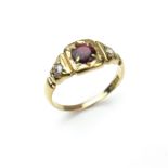 18 ct yellow gold garnet and diamond ring.