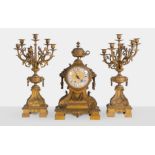 Trittico in bronzo dorato con orologio e due candelabri, Francia, XIX sec.