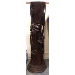 A South East Asian carved wooden plinth decorated with flowers Condition Report: Available upon