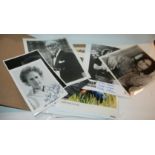 A collection of autographed photographed of music stars etc Condition Report: Available upon