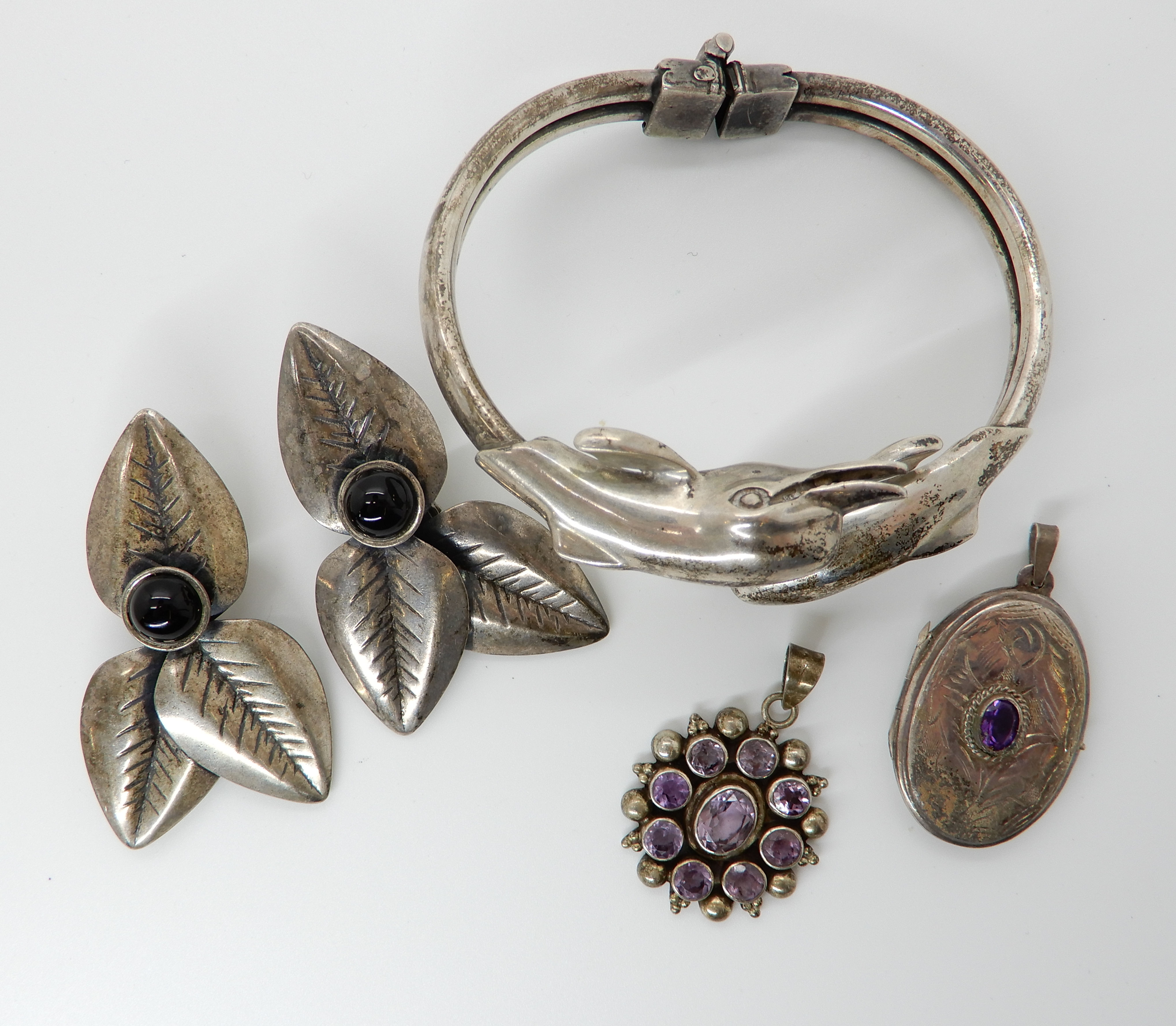 A silver dolphin bangle, two amethyst pendants and a pair of earrings Condition Report: Not - Image 2 of 2