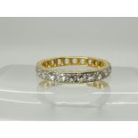 An 18ct gold clear gem set full eternity ring, size N1/2, weight 2.6gms Condition Report: