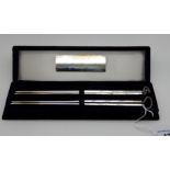 Two pairs of sterling silver chopsticks in box with plaque inscribed "Presented by the Brethren of