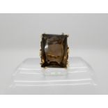 A yellow metal mounted large smoky quartz set ring size O1/2, weight 11.8gms Condition Report: