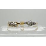 A bright yellow metal old cut diamond cluster ring size O1/2 and a three stone diamond ring size