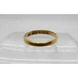 An 18ct gold Glasgow hallmarked wedding ring, dated 1883, size P1/2, weight 2.3gms Condition Report: