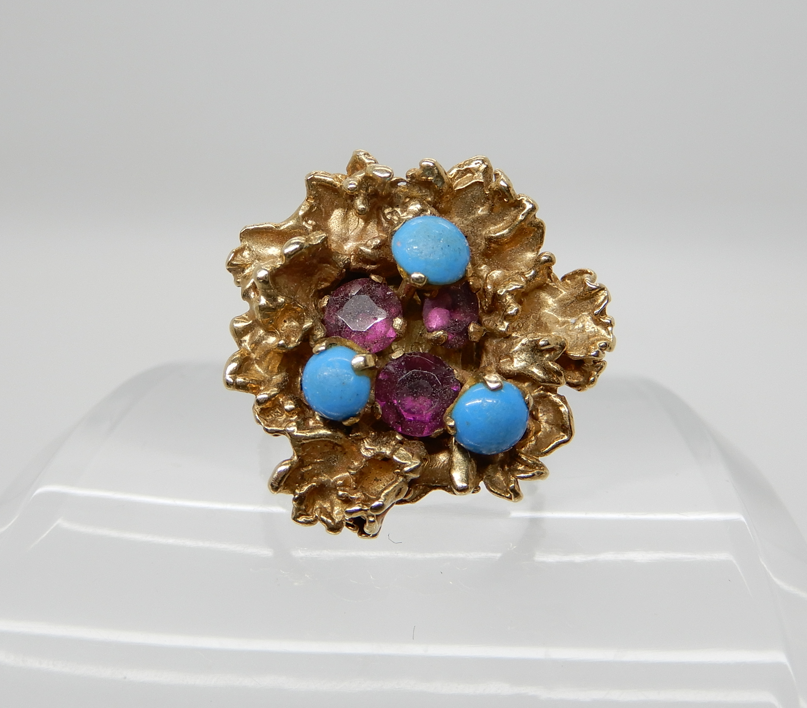 A 9ct gold retro ring set with turquoise and pink gems size O, weight 8.5gms Condition Report: