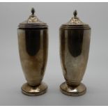 A pair of silver sugar castors by Sanders & MacKenzie, Birmingham 1937, 15cm high, 296gms