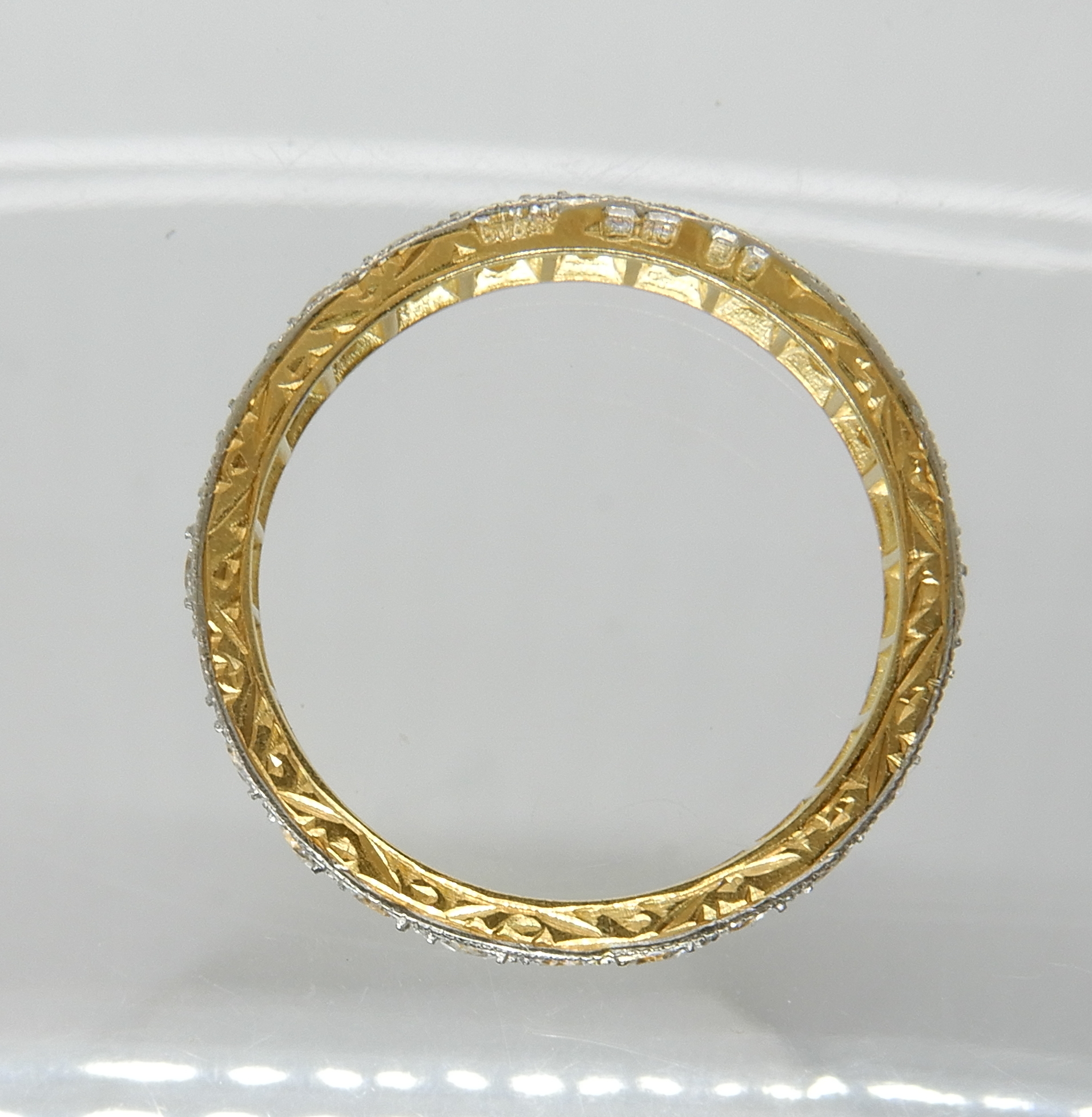 An 18ct gold clear gem set full eternity ring, size N1/2, weight 2.6gms Condition Report: - Image 2 of 3