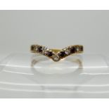 A 9ct herringbone shaped ring set with sapphires and diamonds, size U1/2, weight 3gms Condition
