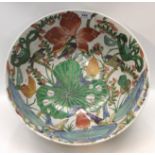 A large Chinese bowl, decorated with foliage and flowers, 41cm diameter Condition Report: