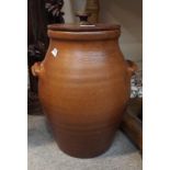 A stoneware jar with wooden lid Condition Report: Available upon request