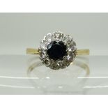 An 18ct gold sapphire and diamond flower cluster ring, set with estimated approx 0.40cts of