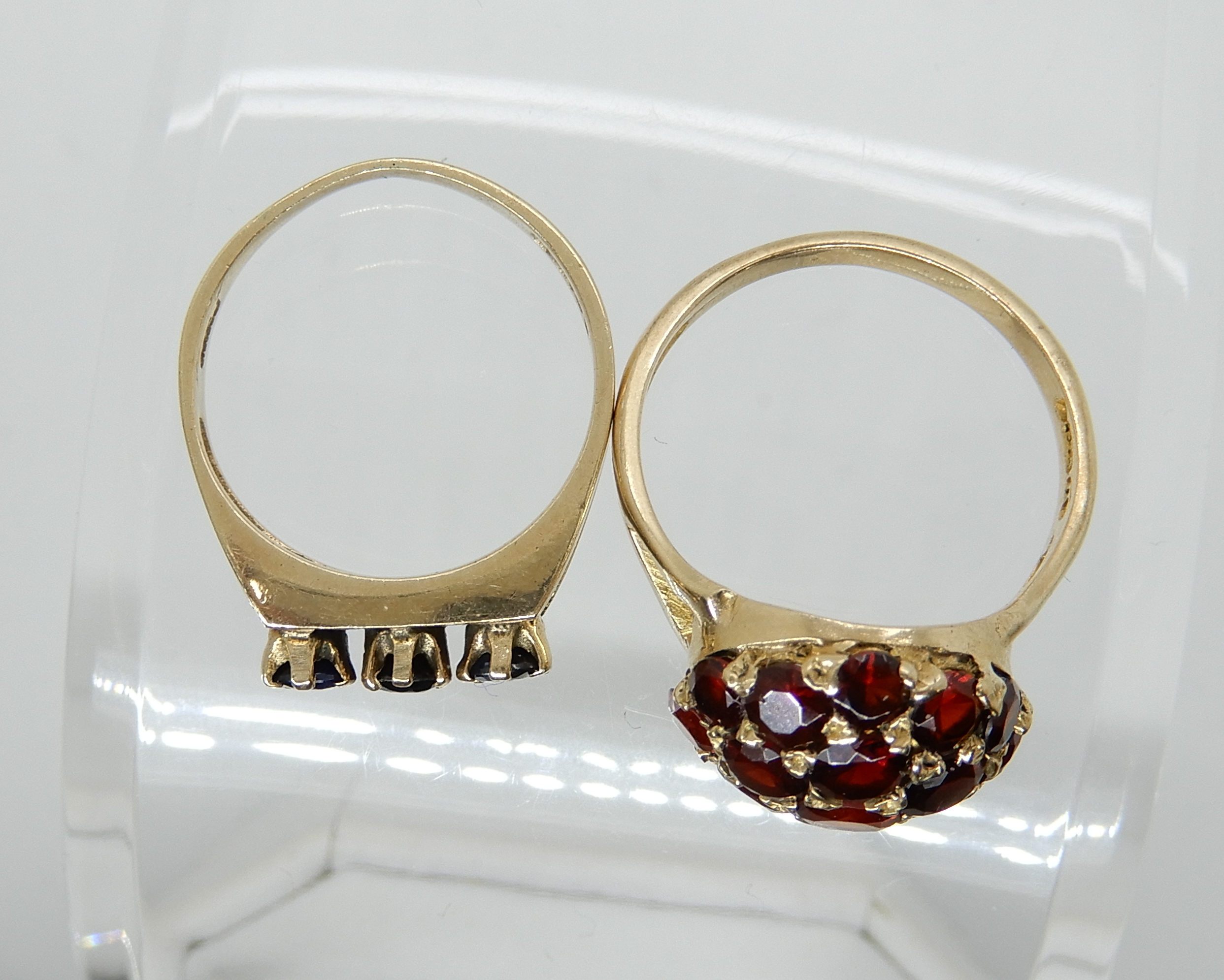 A 9ct gold garnet set dome ring, size O1/2, together with a retro sapphire set ring size L1/2, - Image 2 of 3