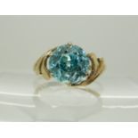 A 9ct gold blue zircon ring, size approx L (zircon through back of setting) weight 2.7gms