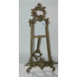 A gilt-metal table easel, 55cm high Condition Report: Available upon request