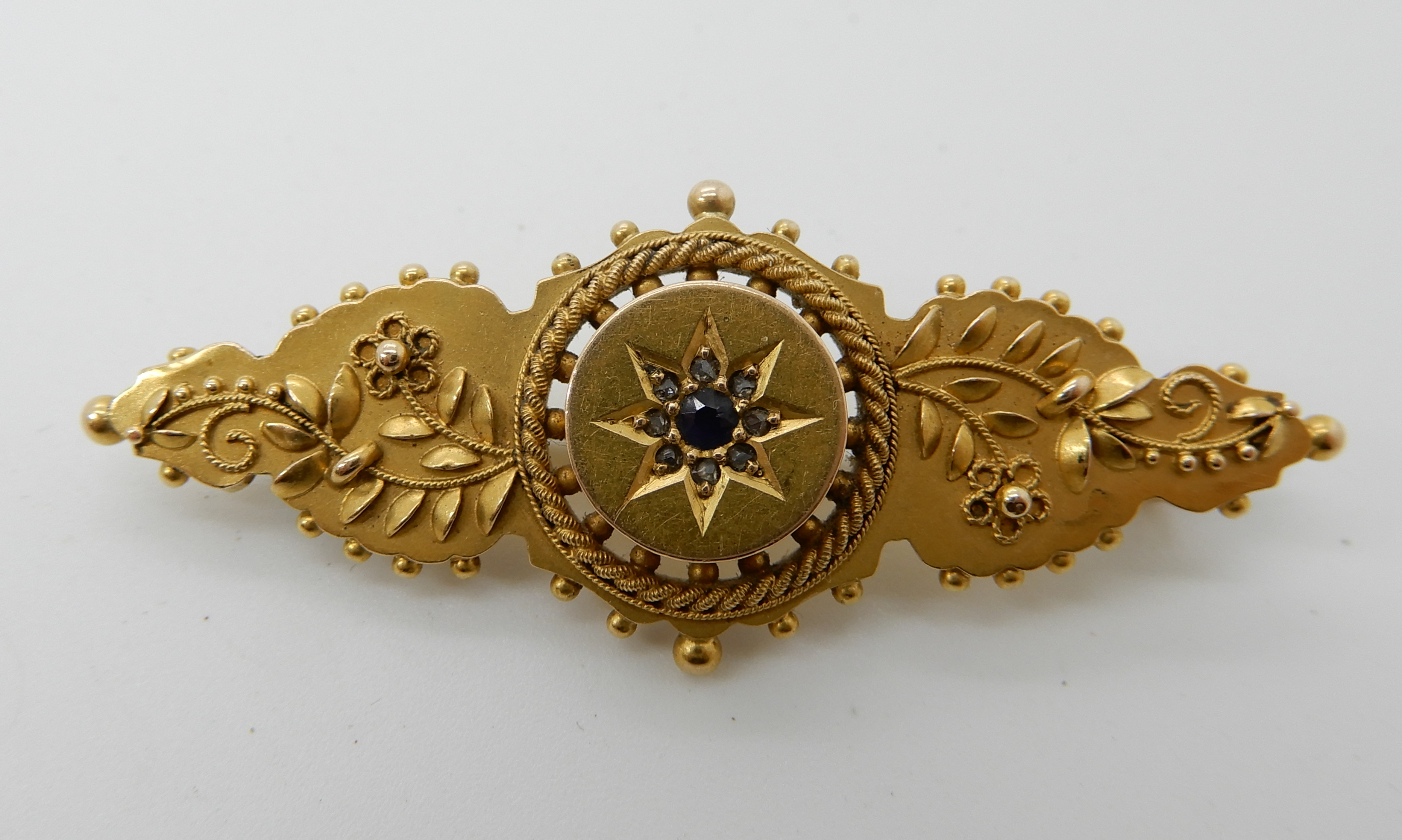 A 15ct gold diamond and sapphire Victorian brooch, length 4.8cm, weight 4.3gms Condition Report: