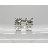 A pair of 18ct white gold diamond studs set with estimated approx 0.70cts of brilliant cut diamonds,