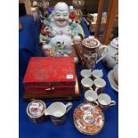 A ceramic laughing buddha, a sake set, a coffee set and fish cutlery Condition Report: Available