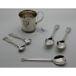 A lot comprising a sterling silver christening mug, two silver teaspoons, two silver mustard