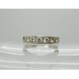 An 18ct white gold seven stone diamond ring (one diamond missing) set with 0.30cts of brilliant