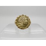 A 14k ring stamped 585, set with a Greek style coin, size P, weight 4.4gms Condition Report: