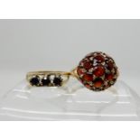 A 9ct gold garnet set dome ring, size O1/2, together with a retro sapphire set ring size L1/2,