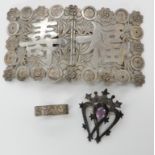 A John Hart of Iona silver luckenbooth brooch set with an amethyst, a Chinese white metal buckle and