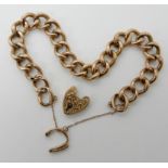 A 9ct gold hollow construction curb link bracelet with heart shaped clasp (af) Condition Report: