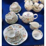 A Haddon Hall tea service comprising teapot, milk jug, sugar bowl, six cups, five saucers, six