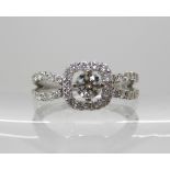 A platinum diamond cluster ring set with estimated approx 0.60cts of brilliant cut diamonds, the