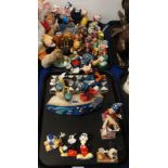 A collection of Disney figures including Disney Traditions Mickey mouse, Winnie the Pooh, Dumbo,