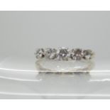 An 18ct gold five stone diamond ring, set with estimated approx 0.53cts of brilliant cut diamonds,