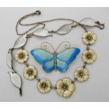 A large silver and enamel David Andersen butterfly brooch, a silver leaf bracelet and a further