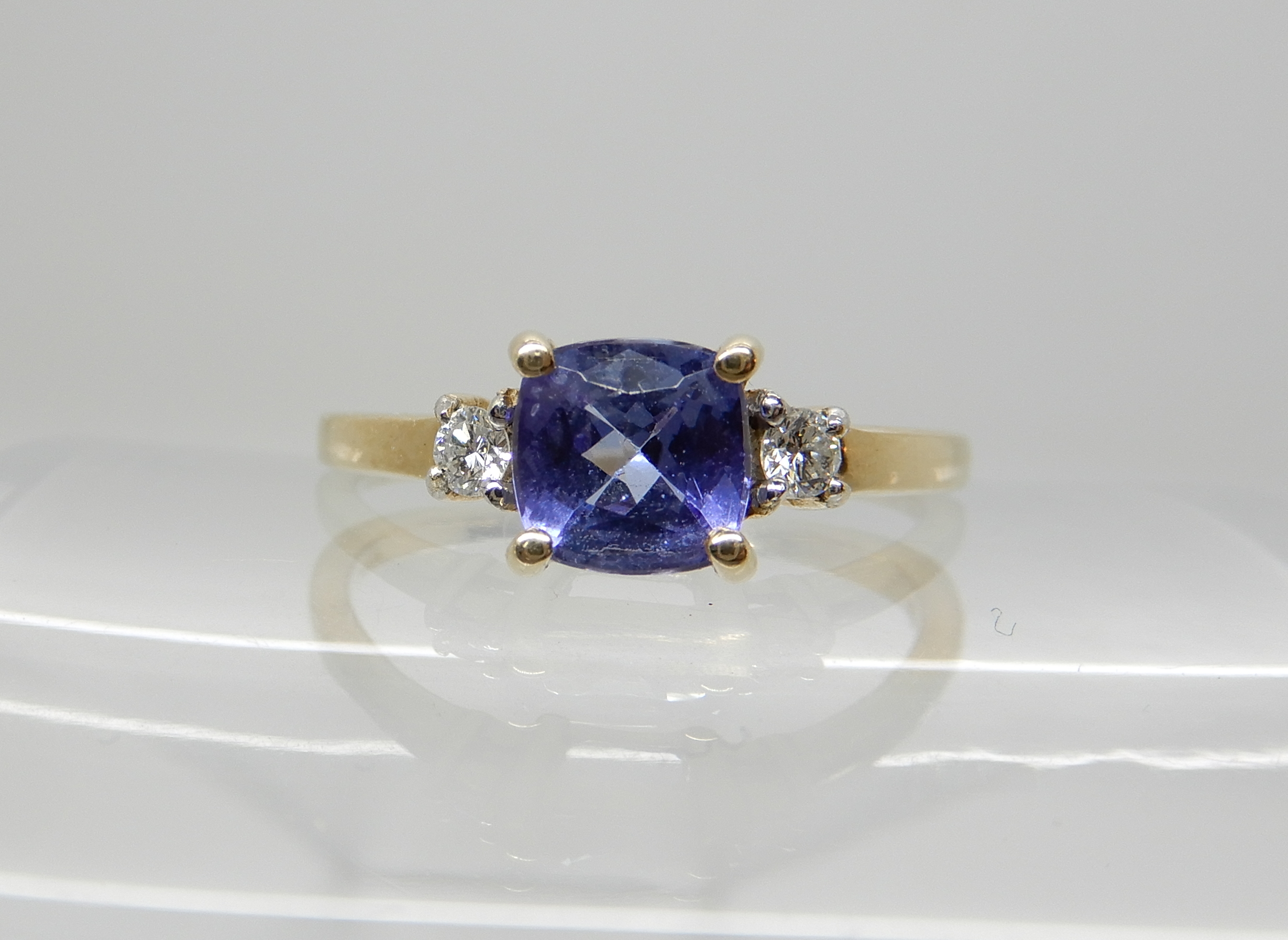 A 9ct gold tanzanite and diamond ring, size Q, weight 2.3gms Condition Report: Available upon