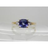 A 9ct gold tanzanite and diamond ring, size Q, weight 2.3gms Condition Report: Available upon