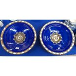 A pair of blue glazed Moroccan style dishes with applied metal decoration Condition Report: