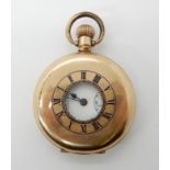 A gold plated half hunter pocket watch with enamelled chapter ring, retailed by Street & Co