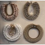 Four tribal seashell necklaces Condition Report: Available upon request