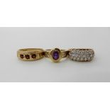 A 9ct gold amethyst set Mackintosh style ring, size L, a 9ct garnet ring size T1/2 and a 9ct clear