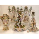 A pair of Meissen style candelabra together with two other continental candlestands and a vase