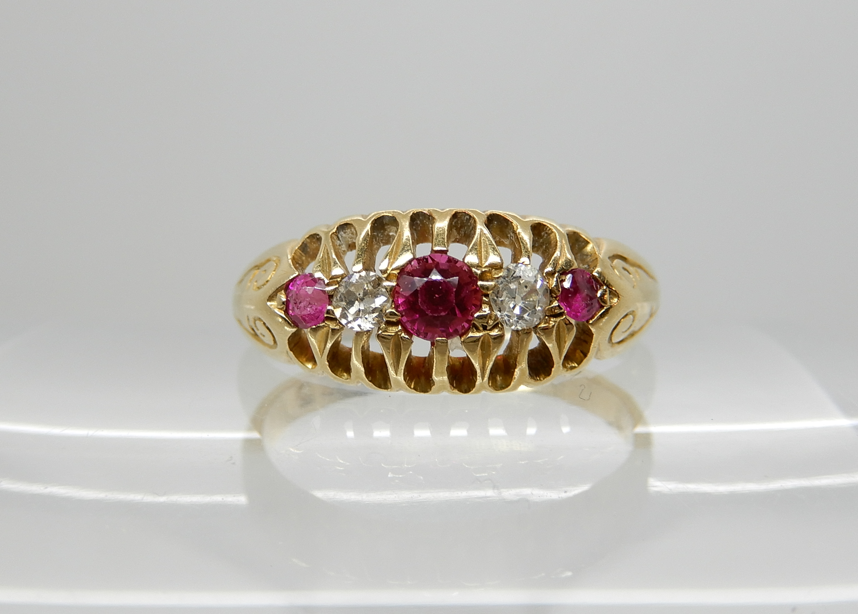 An 18ct gold diamond and red gem ring, size O, weight 3.7gms Condition Report: Available upon