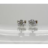 A pair of white metal (butterflies stamped 750) diamond stud earrings of estimated approx 0.50cts