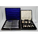 A lot comprising a cased set of six silver coffee spoons, Sheffield 1935 and a cased set of silver