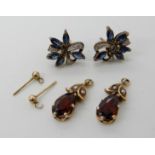 A pair of yellow metal sapphire and diamond accent earrings approx 1.6cm and a pair of 9ct garnet