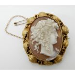 A well carved shell cameo of a maiden in a yellow metal decorative mount, 4.6cm x 4cm, weight 14.